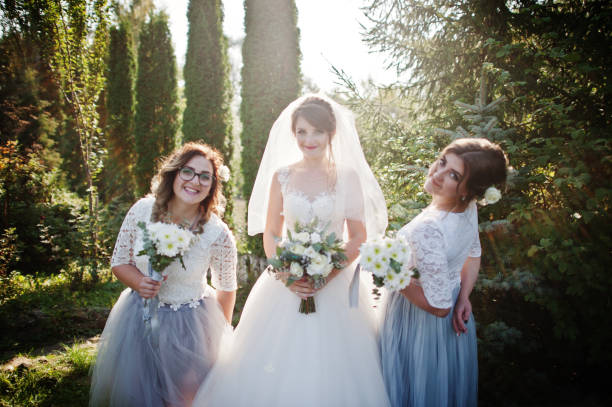 istock Happy bride posing with her bridesmaids 1002778848