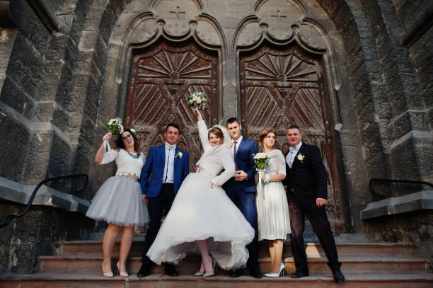 istock Wedding couple and groomsmen with bridesmaids 1002779410