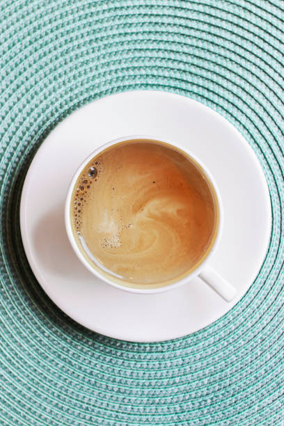 Top View Composition with Cup of Coffee on Tablecloth