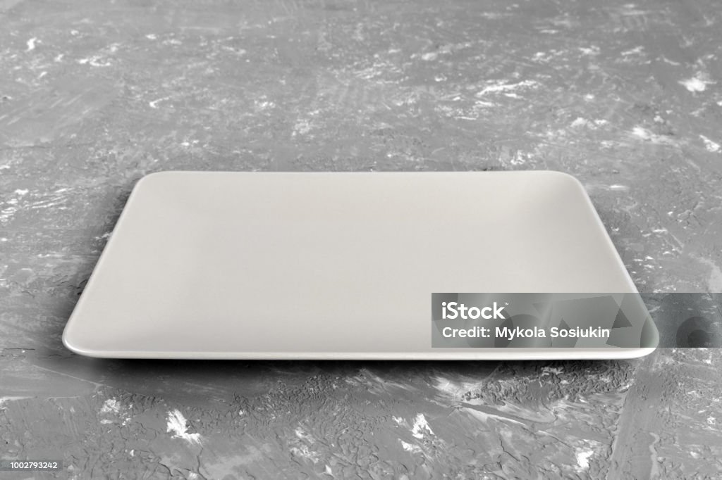 Empty Rectangular Plate Empty Rectangular Plate On Gray Table Background Stock Photo - Download ...