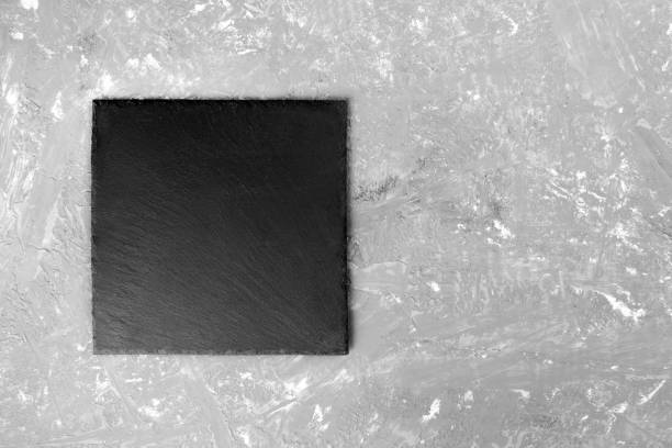istock black slate plate for serving with copy space, top view 1002793244