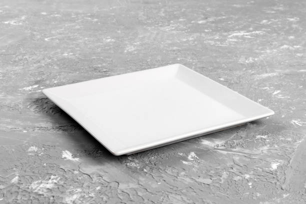 empty rectangular Plate on gray table background stock photo