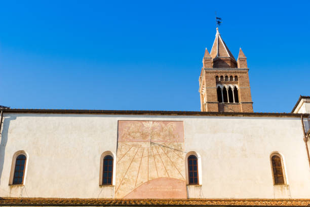 reloj de sol en un lado de la catedral de grosseto en italia - grosseto province fotografías e imágenes de stock