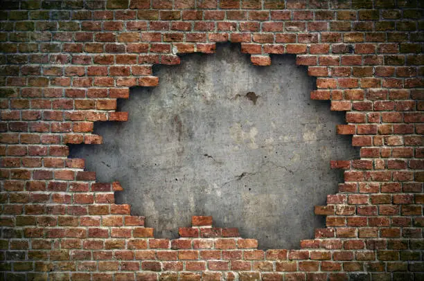 Photo of Old red brick wall damaged background