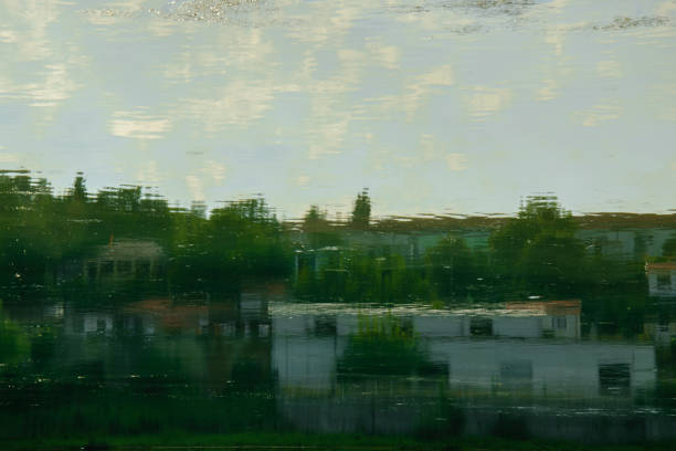 istock Abstract water reflection of countryside houses 1002804626