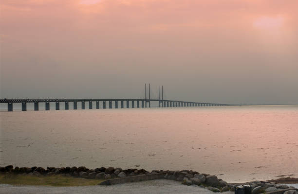 istock Oresund Bridge on sunset, Sweden, Malmo. 1002804636