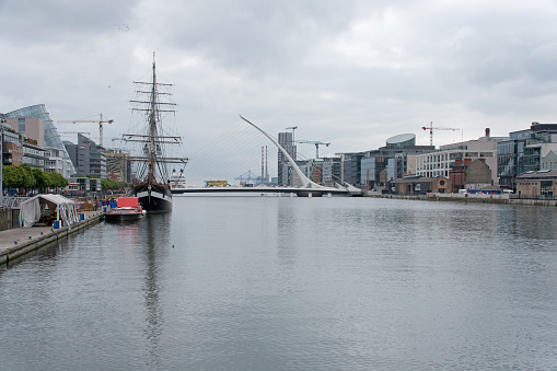 Old sailing ship on River Liffey, Samuel Beckett Bridge and the CCD, Dublin, Ireland