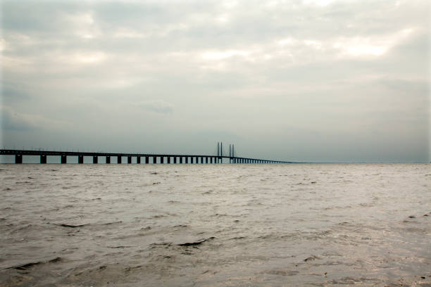 istock Oresund Bridge on sunset, Sweden, Malmo. 1002824504