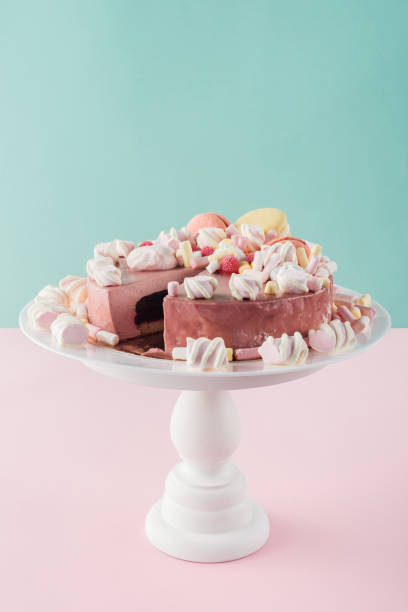 istock sweet cake with marshmallows and macarons on cake stand 1002832644
