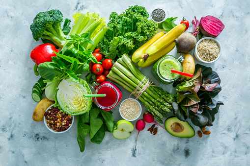 Overhead view of a large group of healthy food for a well balanced diet arranged side by side on black background. High resolution 42Mp studio digital capture taken with SONY A7rII and Zeiss Batis 40mm F2.0 CF lens