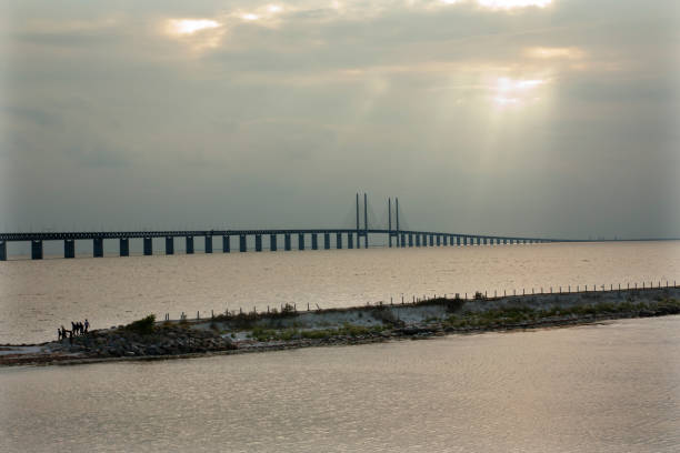 istock Oresund Bridge on sunset, Sweden, Malmo. 1002839016