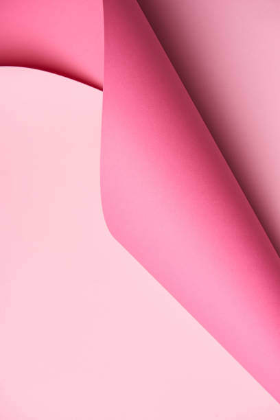 istock close-up view of beautiful creative abstract pink paper background 1002847524