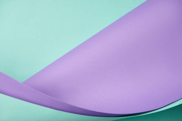 istock beautiful violet and turquoise abstract paper background 1002847648