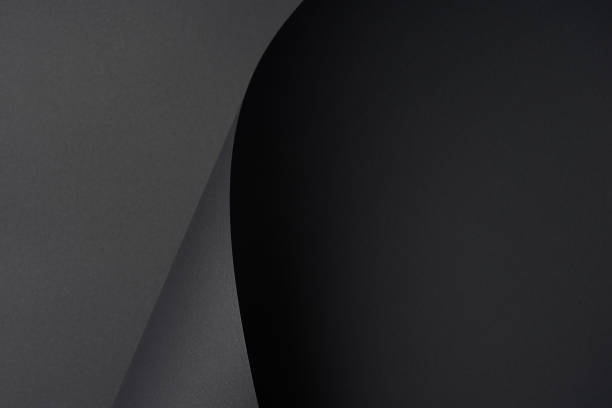 istock dark black abstract textured paper background 1002847906