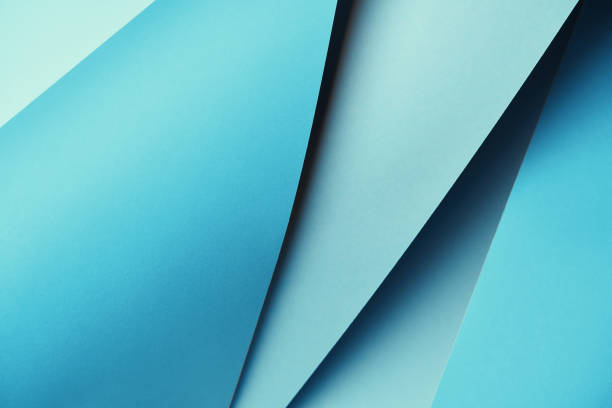 istock beautiful bright blue textured paper background 1002848180