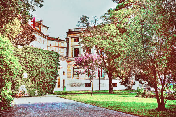 istock Geneva street view with trees summer 1002851086