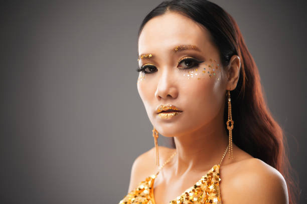 istock Beautiful ethnic woman with festive glitter makeup 1002852174