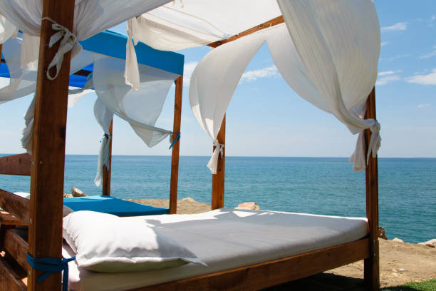 istock Luxury and romantic bed on the seashore for relaxing holidays/vacations 1002852622