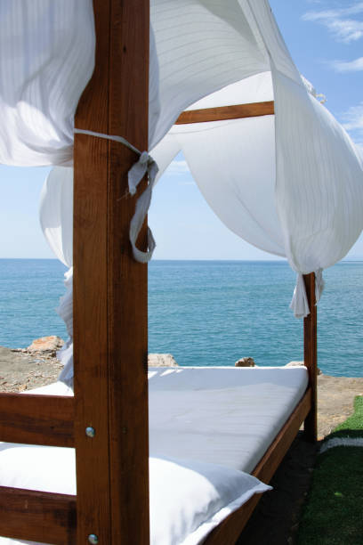 istock Luxury and romantic bed on the seashore for relaxing holidays/vacations 1002852624