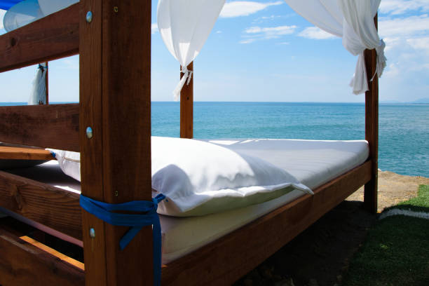 istock Luxury and romantic bed on the seashore for relaxing holidays/vacations 1002852640