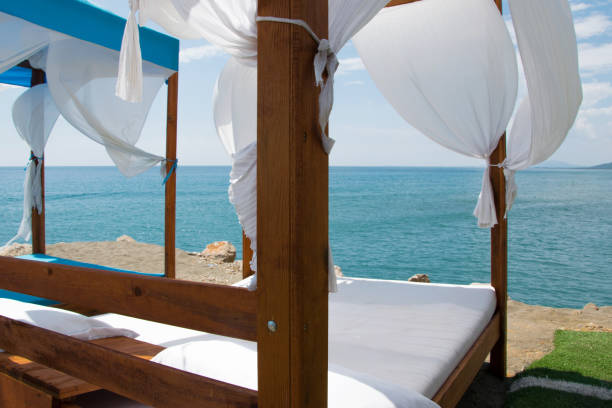 istock Luxury and romantic bed on the seashore for relaxing holidays/vacations 1002852664