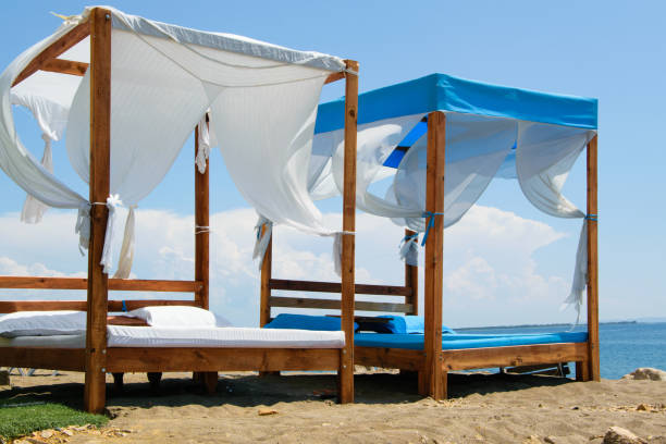 istock Luxury and romantic bed on the seashore for relaxing holidays/vacations 1002852736