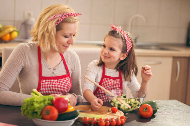 istock Mother and daughter in the kitchen 1002855102