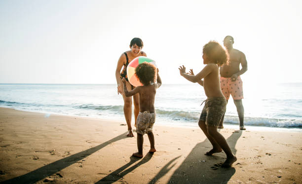 Family playing together at the beach