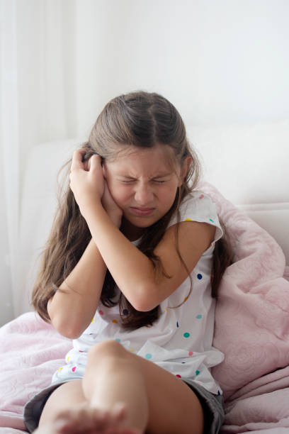 istock Young girl having an earache 1002855698