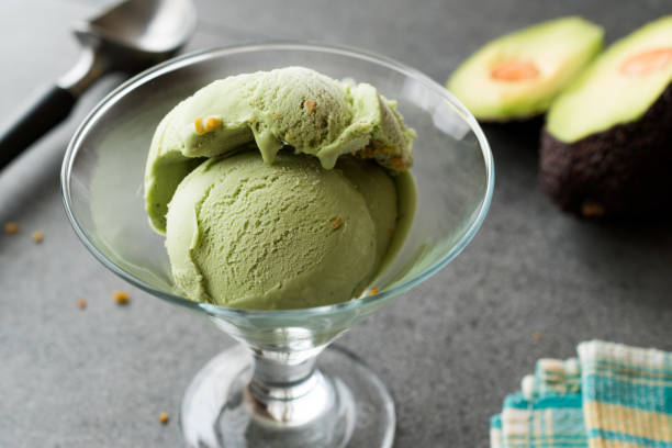 istock Avocado Ice Cream in Glass Cup with Hazelnut Powder 1002856432