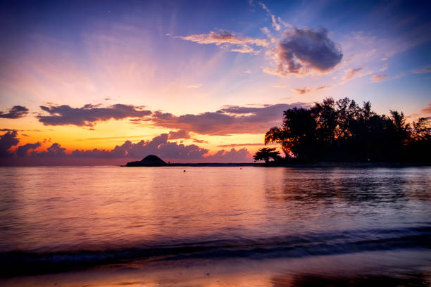 istock beautiful sea view silhouette scenery over stunning sunrise background 1002859594