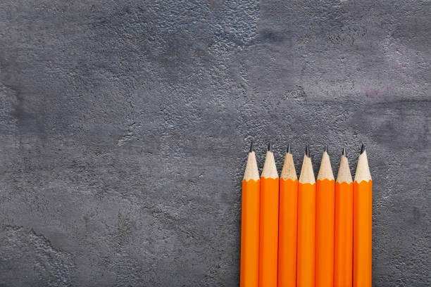 istock Yellow pencils on grey wooden table 1002859842
