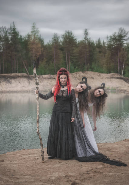 istock Beautiful witch with red hair and horned demons 1002863626