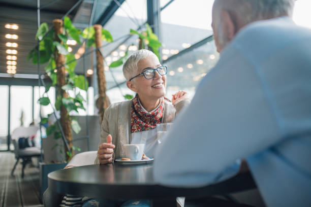 istock Senior couple at coffee shop 1002867124