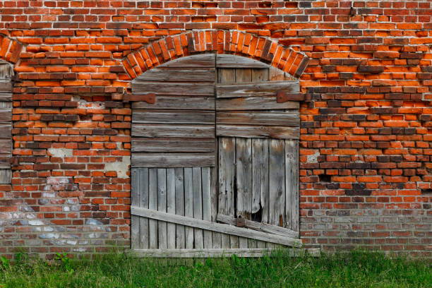 Old wooden door at a brick wall