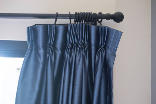 istock Blue curtains decoration in room, close up 1002869230