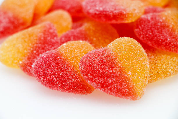 istock Sweet marmalade in sugar - hearts on a white background. 1002872810