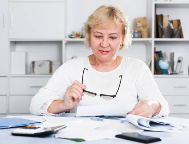 istock Woman engaged in home accounting 1002872966