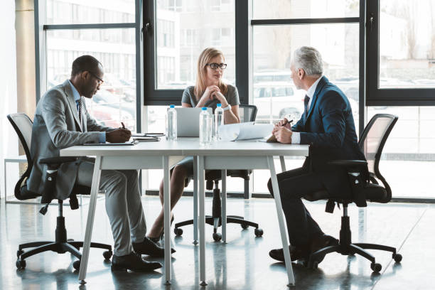 istock professional multiethnic business people working together at table in modern office 1002876892