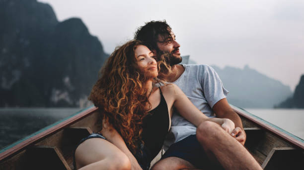 istock Couple boating on a quiet lake 1002877724