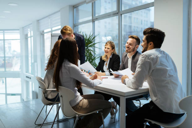 istock Group of business people collaborating in office 1002877794
