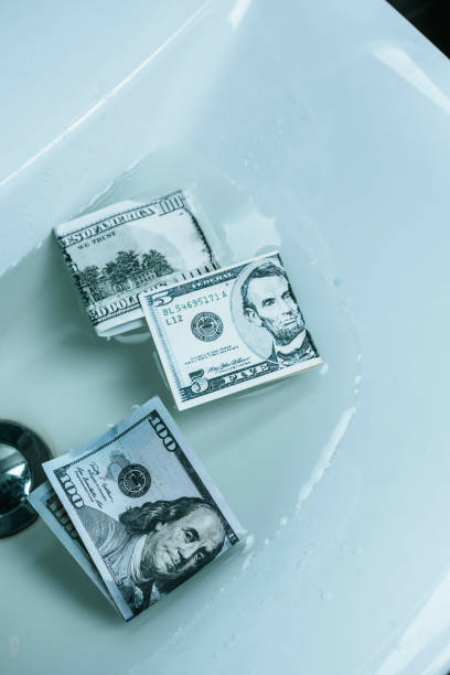 istock top view of dollar banknotes in water in sink 1002878156