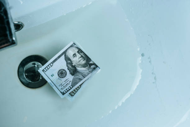 istock top view of dollar banknote in water in sink 1002878174