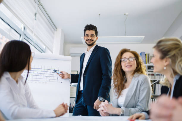 istock Business colleagues working together at office 1002878314
