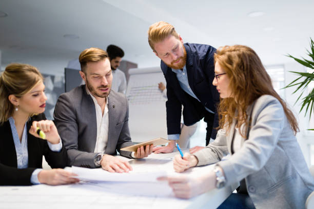 istock Business colleagues working together at office 1002878786