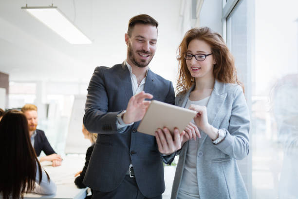 istock Business people having fun in office 1002879020