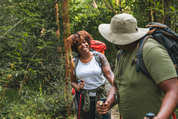 istock Couple trekking in the forest together 1002879256