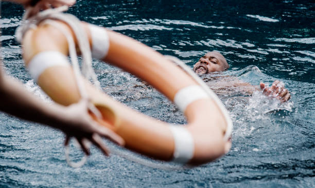 istock Man being rescued from the water 1002883962