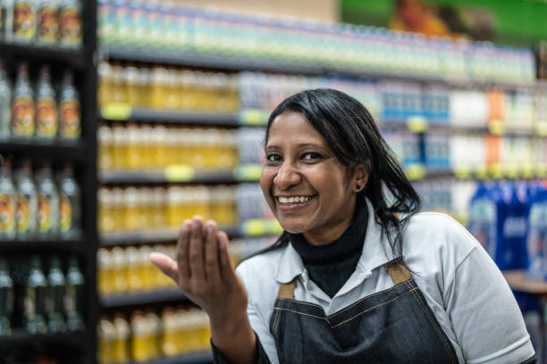 istock Employee Woman Beckoning - Join Our Team 1002884070