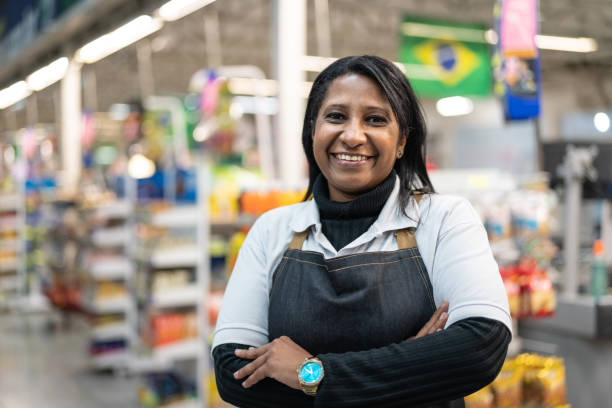 Portrait of smiling seller of a supermarket Real People megastore stock pictures, royalty-free photos & images